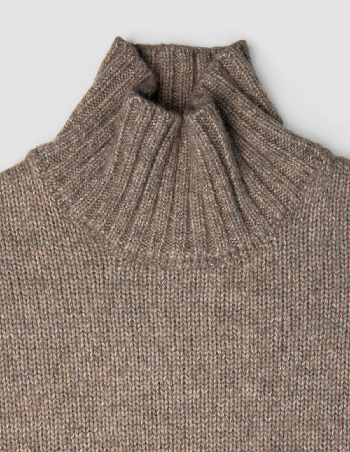 Women Chunky Soft Wool Knit Turtleneck Taupe Melange sweater featuring a chunky knit and a ribbed turtleneck.