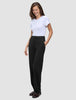 A woman wearing a white t-shirt and Women GO2 Pants Straight Black with her hand in her pocket.