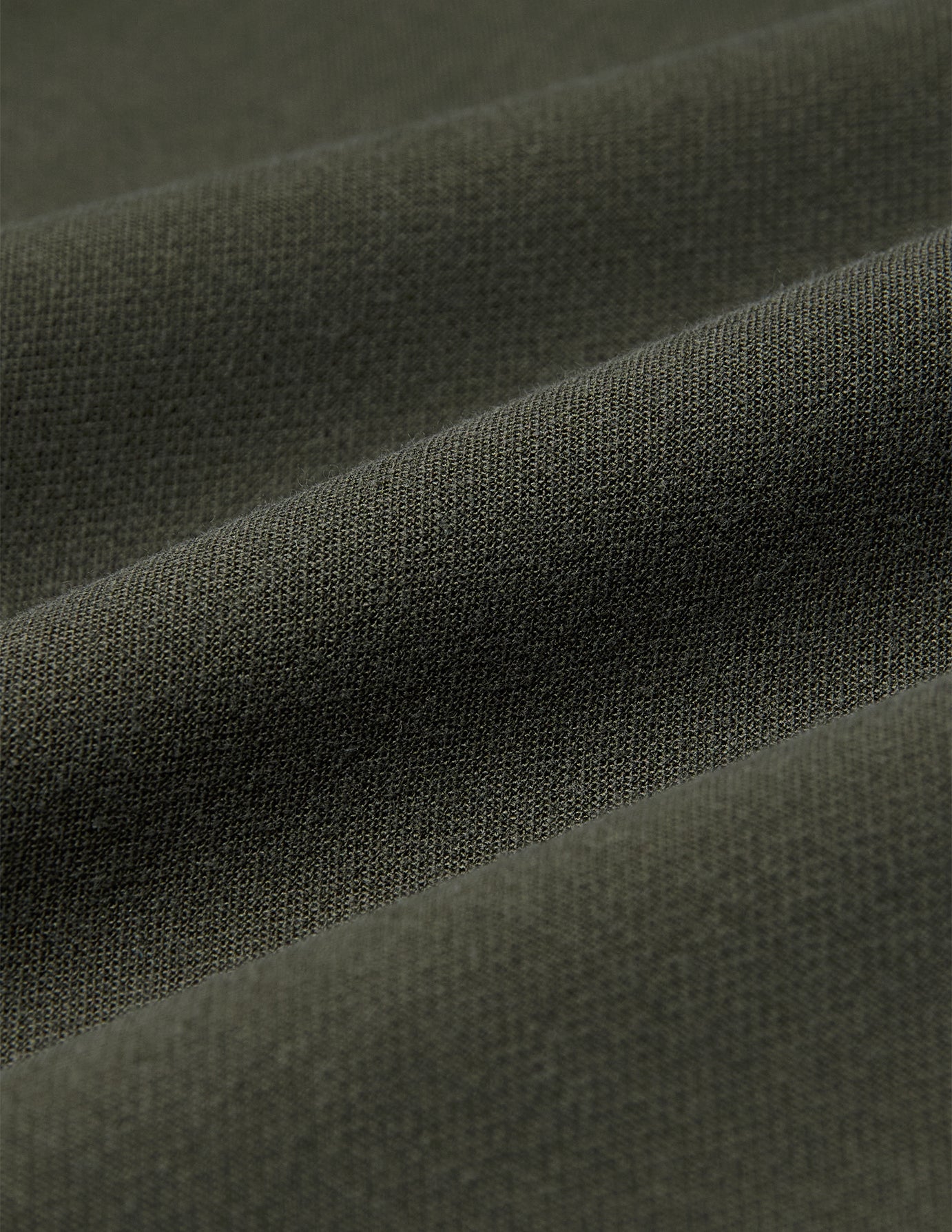 Close-up of olive green fabric for Women GO2 Pants Straight Dusty Olive, featuring a soft, uniform texture and straight-leg design.