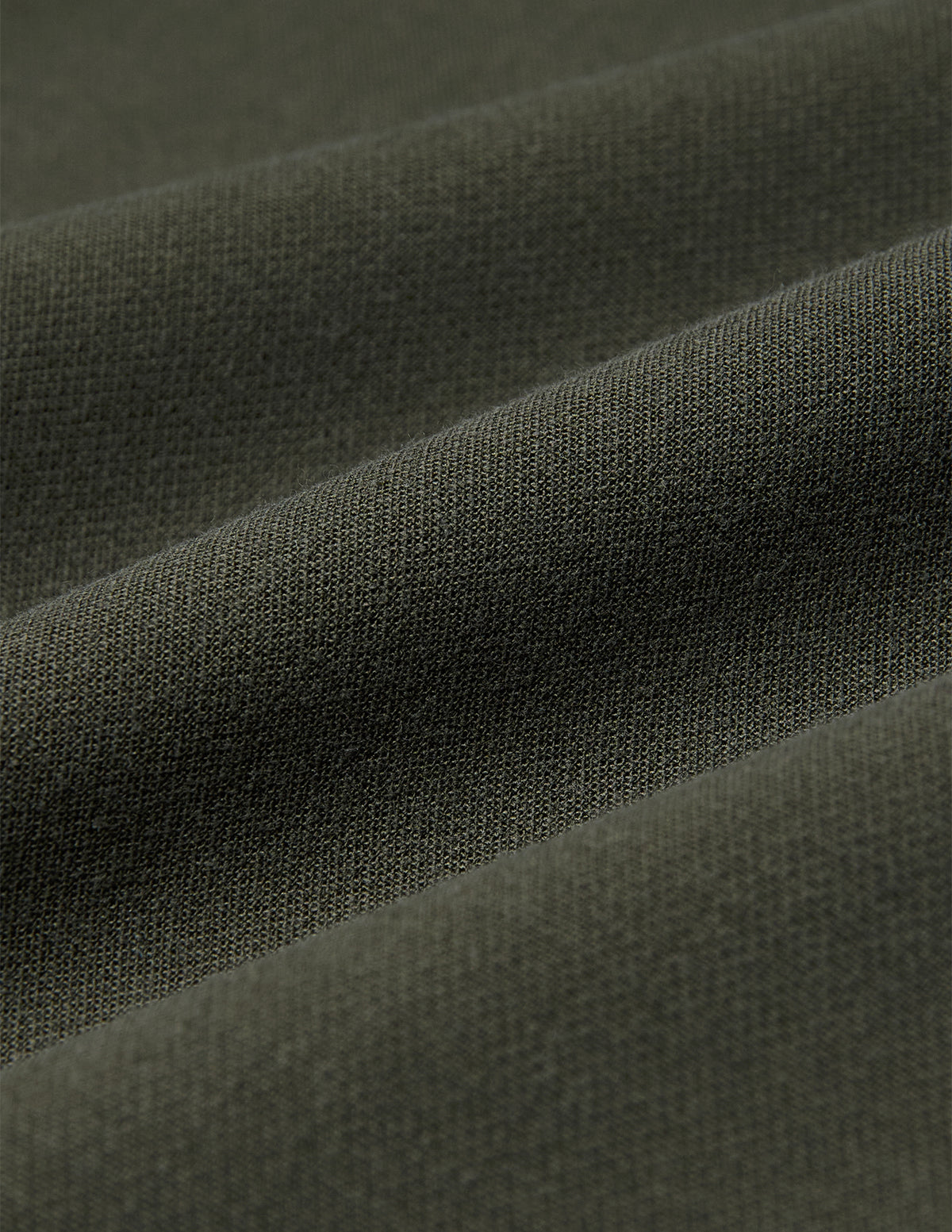Close-up of olive green fabric for Women GO2 Pants Straight Dusty Olive, featuring a soft, uniform texture and straight-leg design.