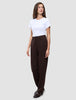 A woman wearing a white t-shirt, Women GO2 Pants Straight Mocha, and loafers.