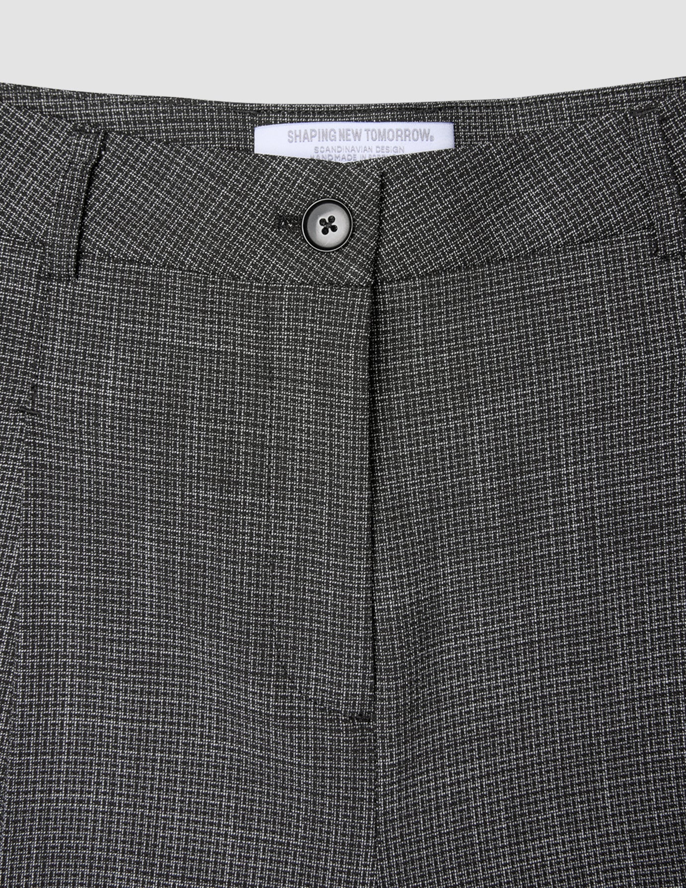 Close-up of the button closure and waistband of the black and white Women Nara Pants Wide Black Check.