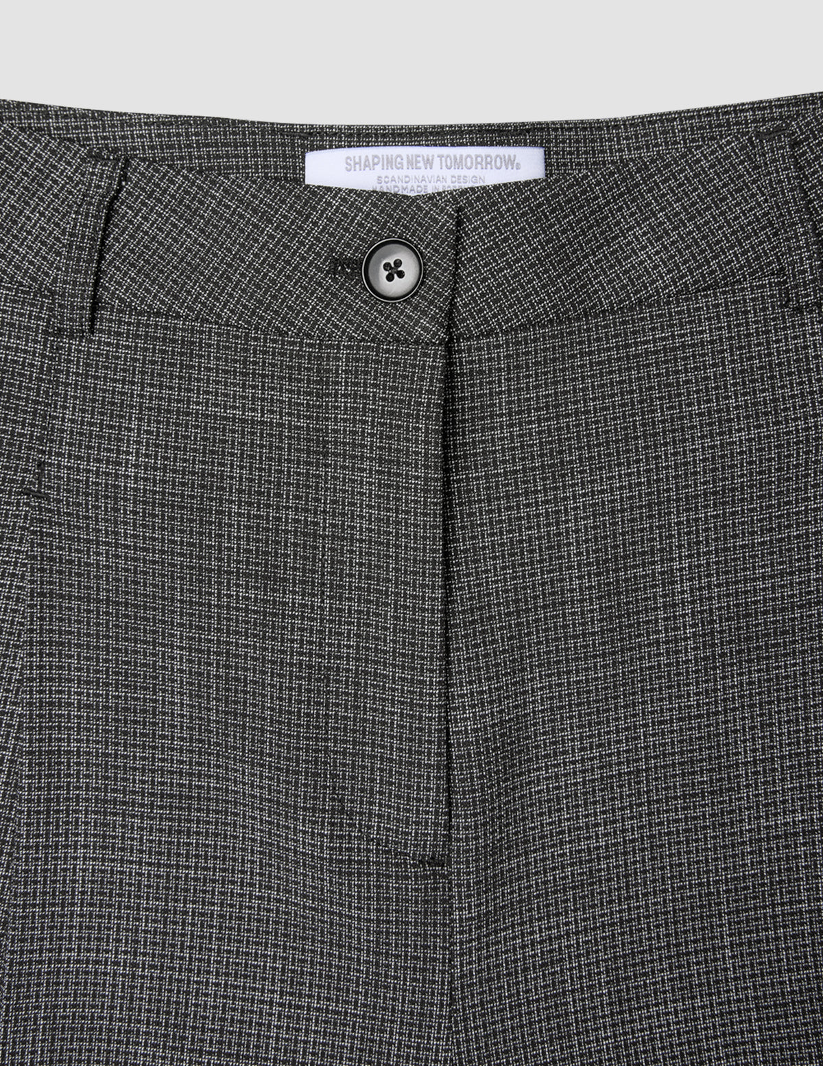 Close-up of the button closure and waistband of the black and white Women Nara Pants Wide Black Check.