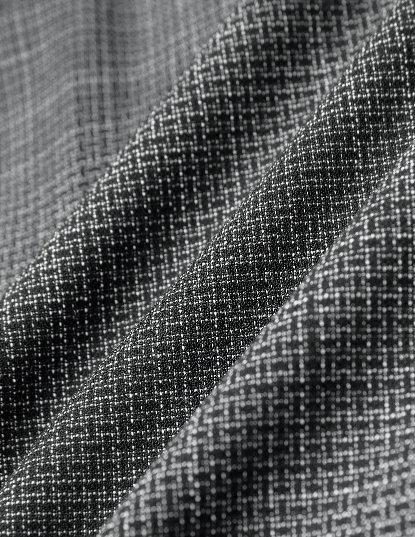 Black and white checkered fabric of Women Nara Pants Wide Black Check with visible folds.