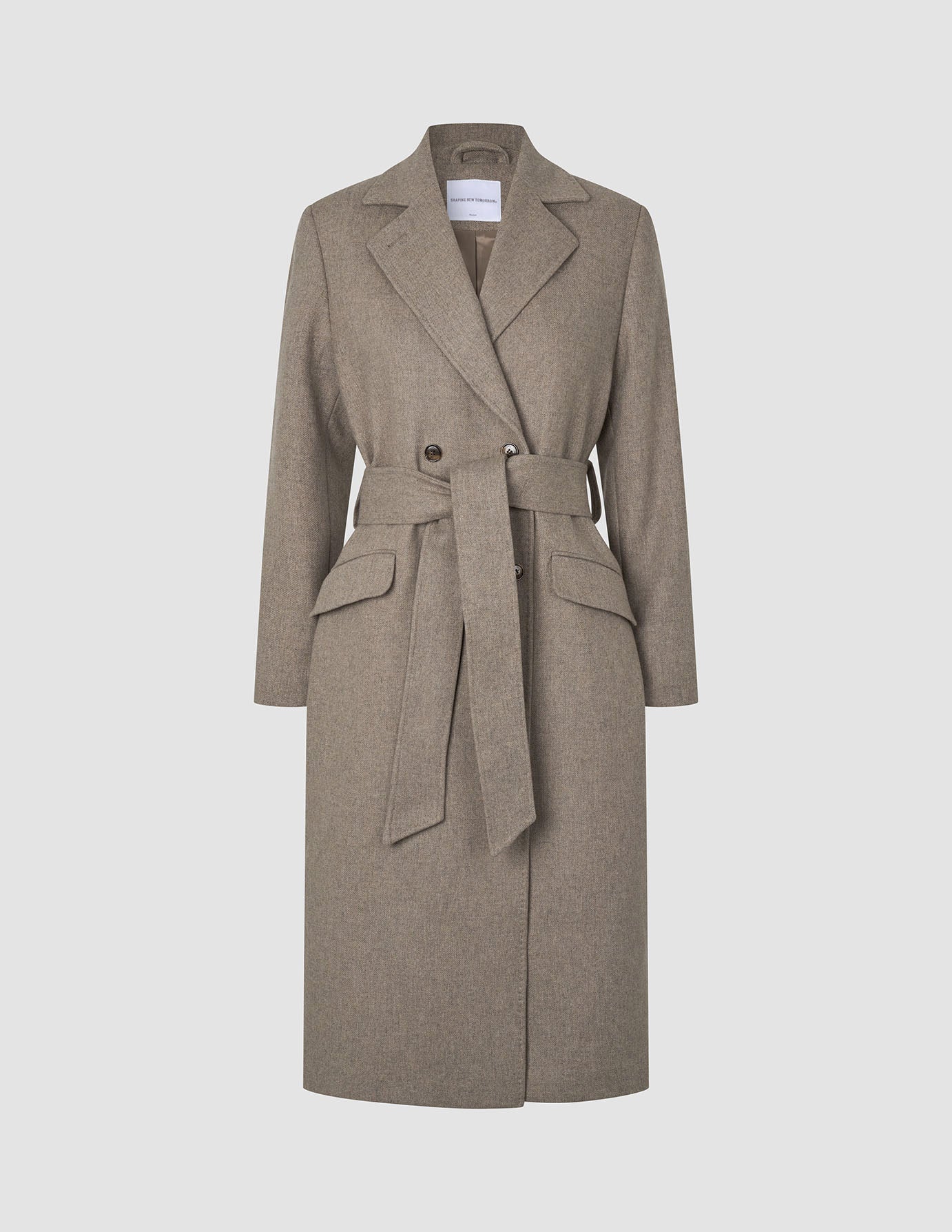Women Wool Coat Greige in a taupe double-breasted Scandinavian design featuring a notched collar, flap pockets, and a matching fabric tie belt at the waist.
