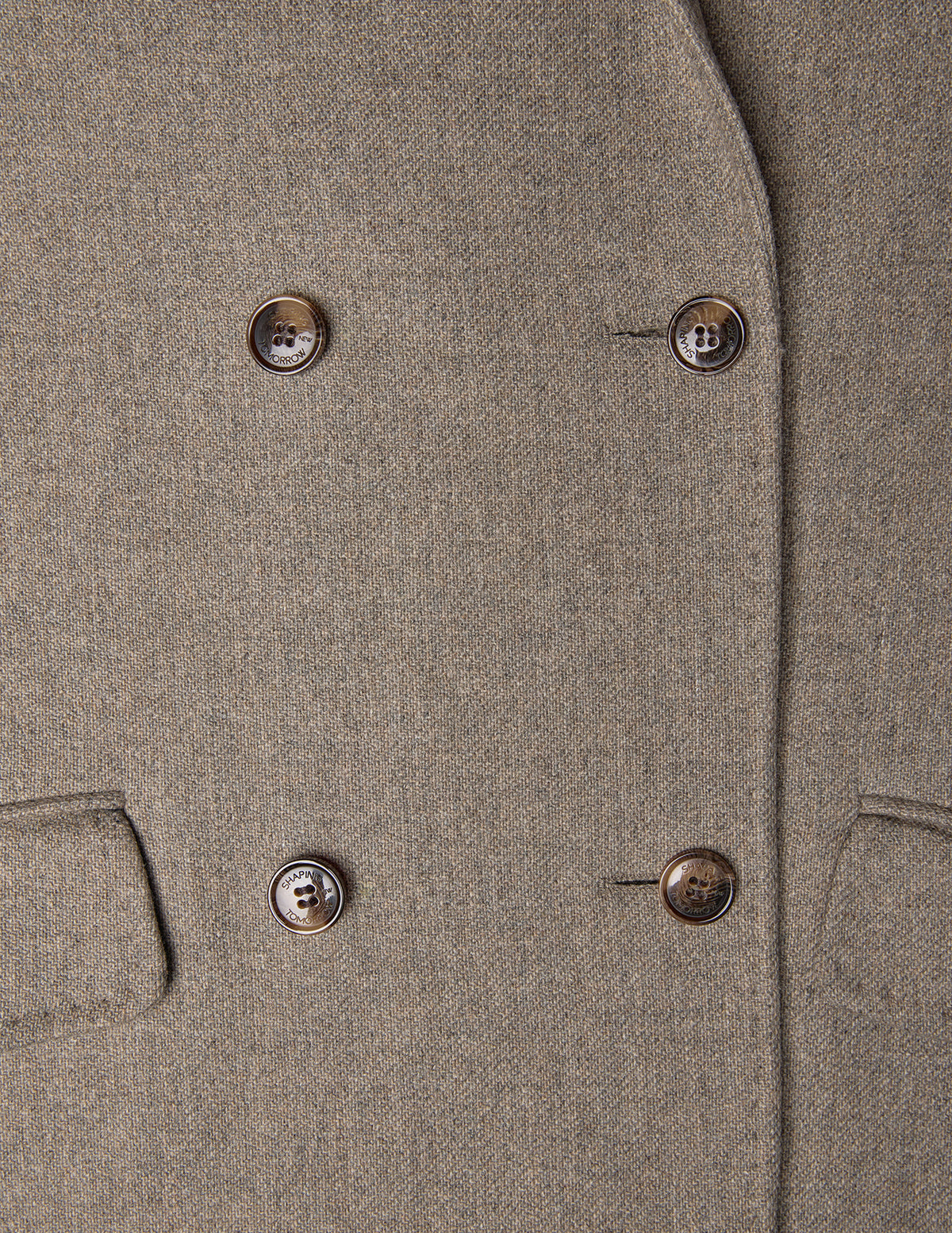 Close-up of a Women Wool Coat Greige, featuring a double-breasted design with four brown buttons in a minimalist Scandinavian style.