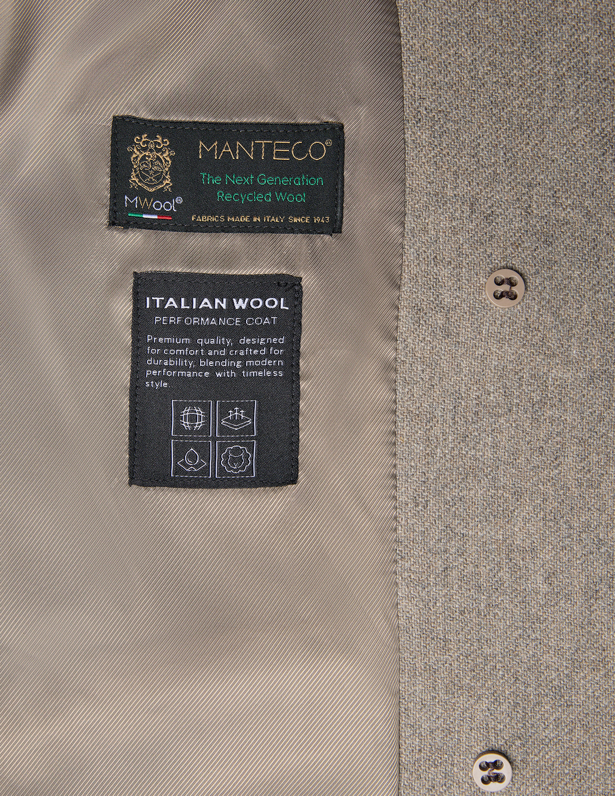 Interior view of the Women Wool Coat Greige, a light gray, double-breasted wool coat featuring two labels detailing Italian recycled wool and performance features, with two buttons visible on the right.
